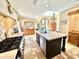 Modern kitchen with granite countertops, stainless steel appliances, and a large center island, perfect for cooking and entertaining at 18805 E Loredo Ln, Rio Verde, AZ 85263