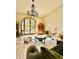 Bright living room featuring an arched window, elegant chandelier, and sophisticated furnishings at 18805 E Loredo Ln, Rio Verde, AZ 85263