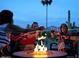 Gathering around an outdoor firepit with mountain views at 18805 E Loredo Ln, Rio Verde, AZ 85263