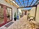 Charming outdoor patio with tile flooring, pergola, and stainless steel grill, perfect for alfresco dining and entertaining at 18805 E Loredo Ln, Rio Verde, AZ 85263