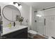 Modern bathroom with walk-in shower, floating vanity, and plants at 19821 N Springfield Dr, Sun City, AZ 85373