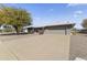 Ranch-style home with a two-car garage and desert landscaping at 19821 N Springfield Dr, Sun City, AZ 85373