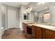 Elegant bathroom with double sinks, a large mirror, and tile flooring at 20089 N 263Rd Dr, Buckeye, AZ 85396