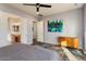 Spacious bedroom with ensuite bathroom access and large art piece at 20089 N 263Rd Dr, Buckeye, AZ 85396