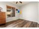 Bright bedroom with wood-look flooring and ample natural light at 20089 N 263Rd Dr, Buckeye, AZ 85396