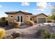 One-story home with stone accents and drought-tolerant landscaping at 20089 N 263Rd Dr, Buckeye, AZ 85396