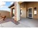 Covered entryway with stone pillars and a security door at 20089 N 263Rd Dr, Buckeye, AZ 85396