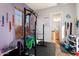 Home gym with weight rack and various exercise equipment at 20089 N 263Rd Dr, Buckeye, AZ 85396