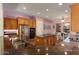 Spacious kitchen with island, stainless steel appliances, and granite countertops at 20089 N 263Rd Dr, Buckeye, AZ 85396