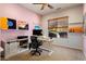 Home office with built-in shelves and large window at 20089 N 263Rd Dr, Buckeye, AZ 85396