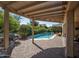 Covered patio with an outdoor lounge area overlooking the swimming pool at 20369 N 272Nd Ave, Buckeye, AZ 85396