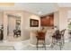 Entertain in style at this wet bar featuring stone counters, and seating for three at 20369 N 272Nd Ave, Buckeye, AZ 85396