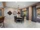 Dining area with decorative accent wall and elegant chandelier at 20369 N 272Nd Ave, Buckeye, AZ 85396