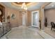 Welcoming foyer with stylish tile flooring, elegant lighting, and a decorative console, creating an inviting entrance at 20369 N 272Nd Ave, Buckeye, AZ 85396