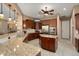 Gourmet kitchen featuring granite countertops, stainless steel appliances, and a functional island at 20369 N 272Nd Ave, Buckeye, AZ 85396