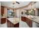 Spacious kitchen featuring granite countertops, stainless steel appliances, and an island at 20369 N 272Nd Ave, Buckeye, AZ 85396