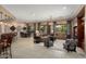 Spacious open-concept living area with stylish furnishings, tile floors, and large windows, perfect for gatherings at 20369 N 272Nd Ave, Buckeye, AZ 85396