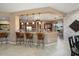 Open floor plan featuring a breakfast bar overlooking the kitchen and dining areas at 20369 N 272Nd Ave, Buckeye, AZ 85396