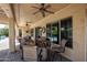 Expansive covered patio features ample seating, ceiling fans, and views of the pool at 20369 N 272Nd Ave, Buckeye, AZ 85396