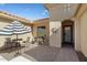 Charming outdoor patio featuring a cozy seating area with stylish furniture and shade, perfect for relaxation and entertaining at 20369 N 272Nd Ave, Buckeye, AZ 85396