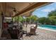 Covered patio with ceiling fans, outdoor seating, and view of the pool at 20369 N 272Nd Ave, Buckeye, AZ 85396