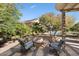 Inviting outdoor patio with a cozy fire pit and seating area, perfect for entertaining at 20369 N 272Nd Ave, Buckeye, AZ 85396