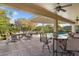 Spacious covered patio overlooking the pool, complete with outdoor seating and dining area at 20369 N 272Nd Ave, Buckeye, AZ 85396
