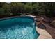 Sparkling pool with water features and lush landscaping, creating a private backyard oasis at 20369 N 272Nd Ave, Buckeye, AZ 85396