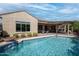 Sparkling pool with a water feature, surrounded by a patio and landscaped yard at 20369 N 272Nd Ave, Buckeye, AZ 85396