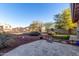Spacious backyard with putting green, patio, and desert landscaping at 20435 N 39Th Dr, Glendale, AZ 85308