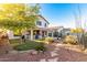 Spacious backyard with putting green, patio, and mature trees at 20435 N 39Th Dr, Glendale, AZ 85308