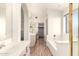Bathroom with double vanity and soaking tub at 20435 N 39Th Dr, Glendale, AZ 85308