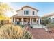 Two story house with a covered patio and landscaped backyard at 20435 N 39Th Dr, Glendale, AZ 85308