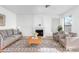 Comfortable living room featuring a fireplace, plush seating, and neutral tones at 20435 N 39Th Dr, Glendale, AZ 85308