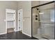 Bathroom featuring a walk-in shower with glass enclosure and built-in seating at 22174 E Creekside Dr, Queen Creek, AZ 85142