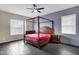Main bedroom with four-poster bed and gray shiplap wall at 22174 E Creekside Dr, Queen Creek, AZ 85142