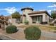 Front view of charming home with mature landscaping at 22174 E Creekside Dr, Queen Creek, AZ 85142