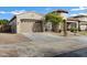 Two-car garage and well-manicured front yard at 22174 E Creekside Dr, Queen Creek, AZ 85142