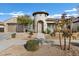 Single-story home with a unique architectural design and landscaping at 22174 E Creekside Dr, Queen Creek, AZ 85142