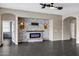 Modern fireplace with stone and wood details at 22174 E Creekside Dr, Queen Creek, AZ 85142