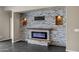 Modern fireplace with stone and wood details at 22174 E Creekside Dr, Queen Creek, AZ 85142