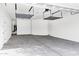 Garage with overhead storage racks and concrete floor at 22174 E Creekside Dr, Queen Creek, AZ 85142
