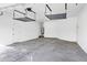 Garage with overhead storage racks and concrete floor at 22174 E Creekside Dr, Queen Creek, AZ 85142