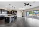 Spacious kitchen with granite countertops, dark cabinetry, and stainless steel appliances at 22174 E Creekside Dr, Queen Creek, AZ 85142