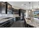 Modern kitchen with granite countertops and stainless steel appliances at 22174 E Creekside Dr, Queen Creek, AZ 85142