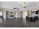 Open living room featuring a modern fireplace and built-in shelving at 22174 E Creekside Dr, Queen Creek, AZ 85142