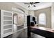 Spacious home office with a corner desk and built-in hutch at 22174 E Creekside Dr, Queen Creek, AZ 85142