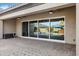 Spacious patio with sliding glass doors leading to pool at 22174 E Creekside Dr, Queen Creek, AZ 85142