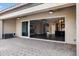 Covered patio with sliding glass doors opening to the living area at 22174 E Creekside Dr, Queen Creek, AZ 85142
