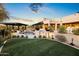 Expansive backyard with a pool, pergola, and lush landscaping at 22400 N 93Rd St, Scottsdale, AZ 85255